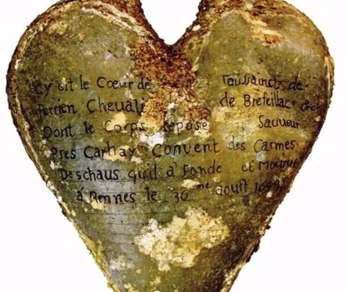 Handout photo of a heart-shaped lead urn found during excavation of the ruins of