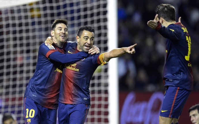 Xavi Hernandez y Lionel Messi