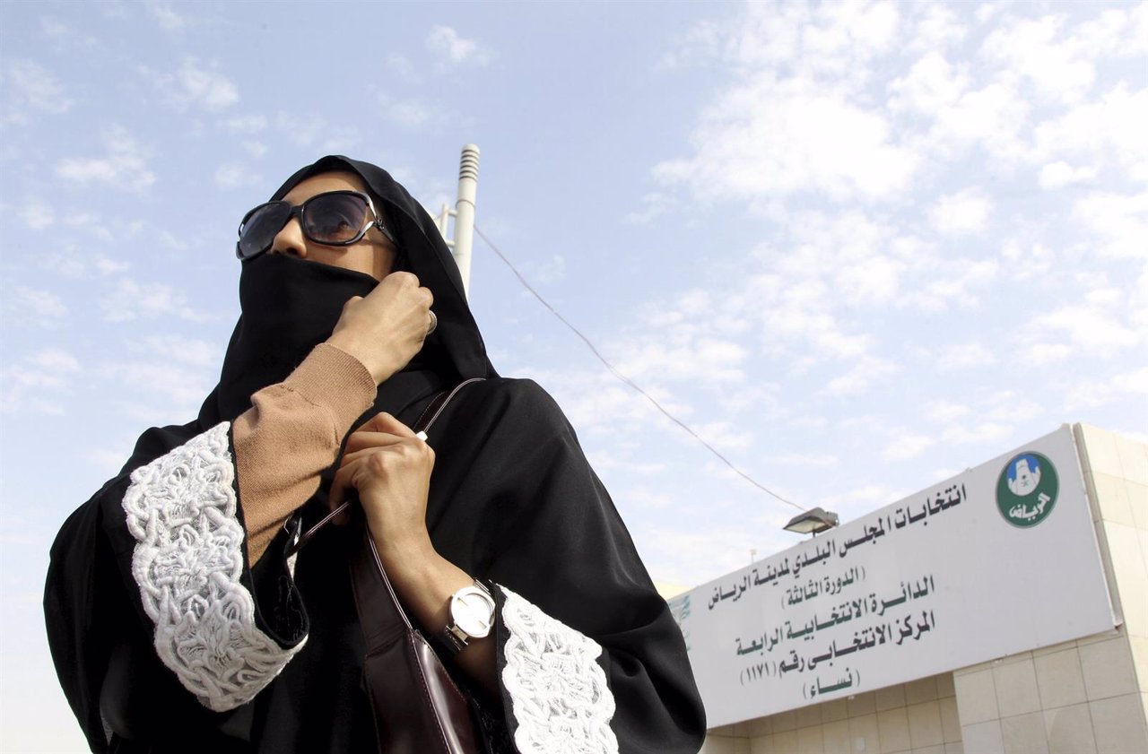 Saudi woman leaves a polling station after casting her vote during municipal ele