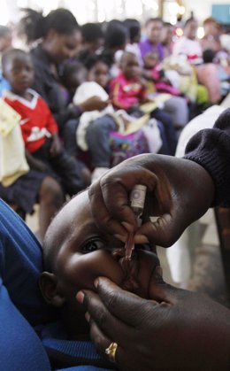 A child receives polio immunisation at a clinic in Harare