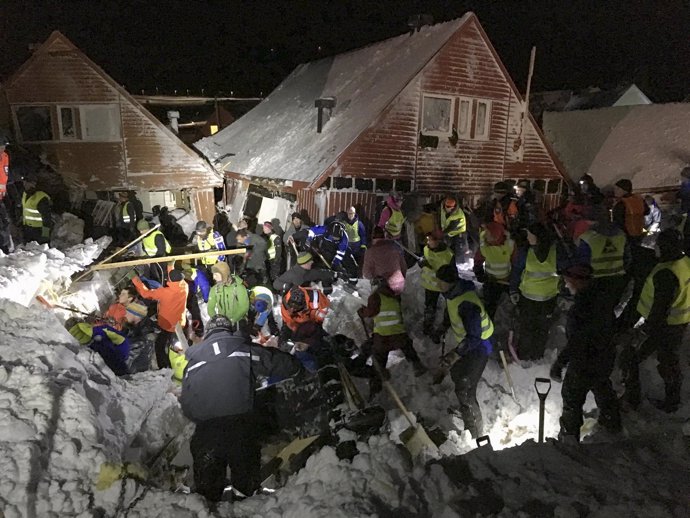 Search crew work in an area hit by an avalanche in Longyearbyen