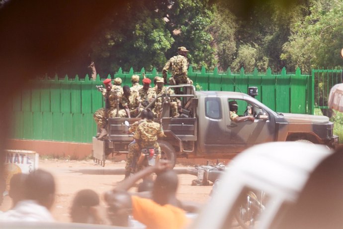 Members of the presidential guard look for protesters in Ouagadougou