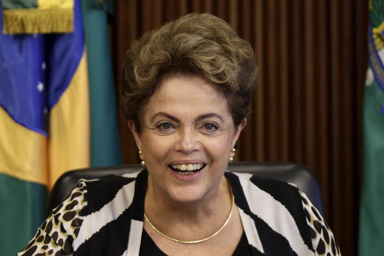 Brazil's President Dilma Rousseff smiles during a meeting with ministers at the 