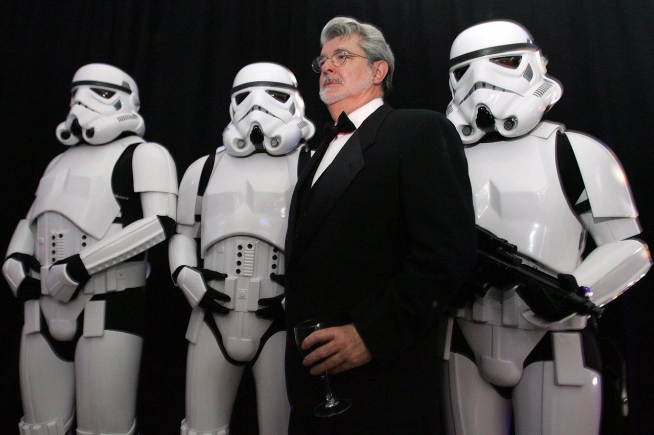 Star Wars creator George Lucas poses with Storm Troopers during a gala in Boston