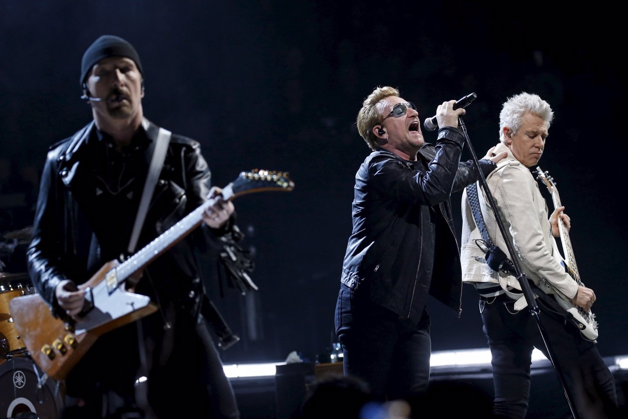 Bono and fellow members of Irish band U2 perform during their concert at the Acc