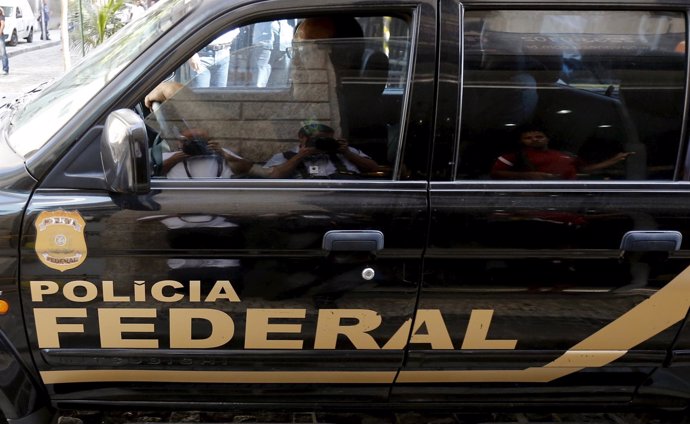 A federal police car leave the headquarters of Eletrobras' Eletronuclear divisio