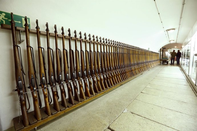 Visitors stand beside guns at the former Swiss artillery fortress Reuenthal 