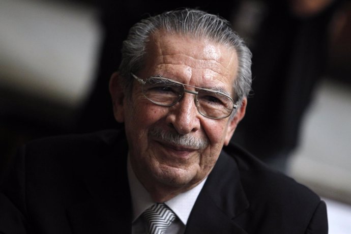 Former Guatemalan dictator Rios Montt smiles during his genocide trial