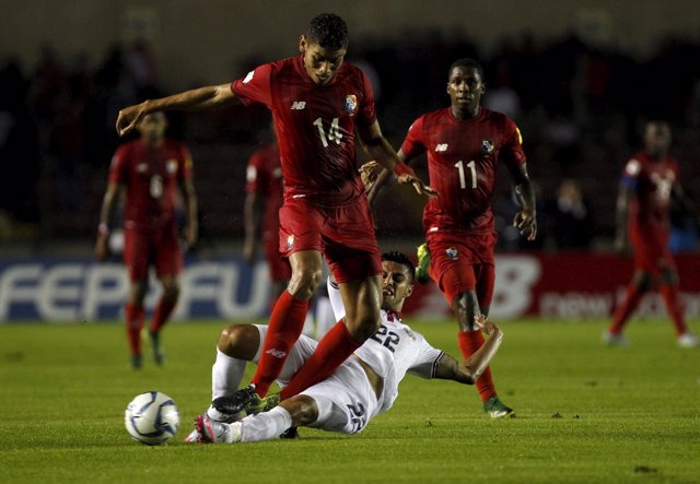 Ronald Matarrita of Costa Rica slides for the ball against Valentin Pimentel of 