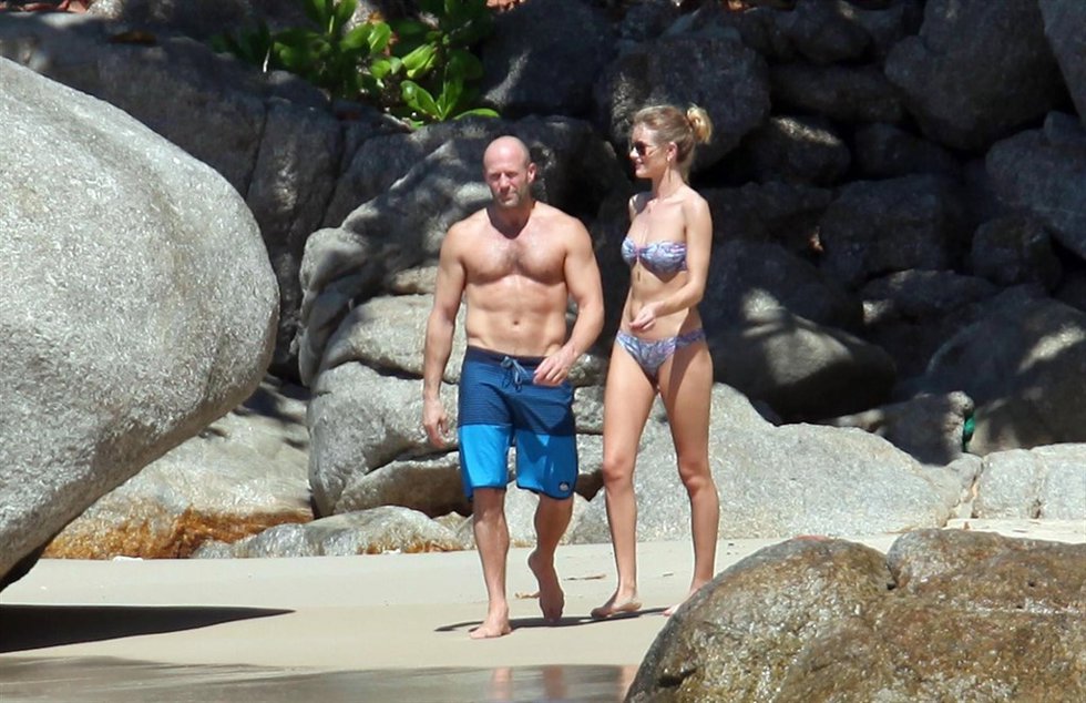 British actor Jason Statham and wife Rosie Huntington-Whiteley enjoying white sa