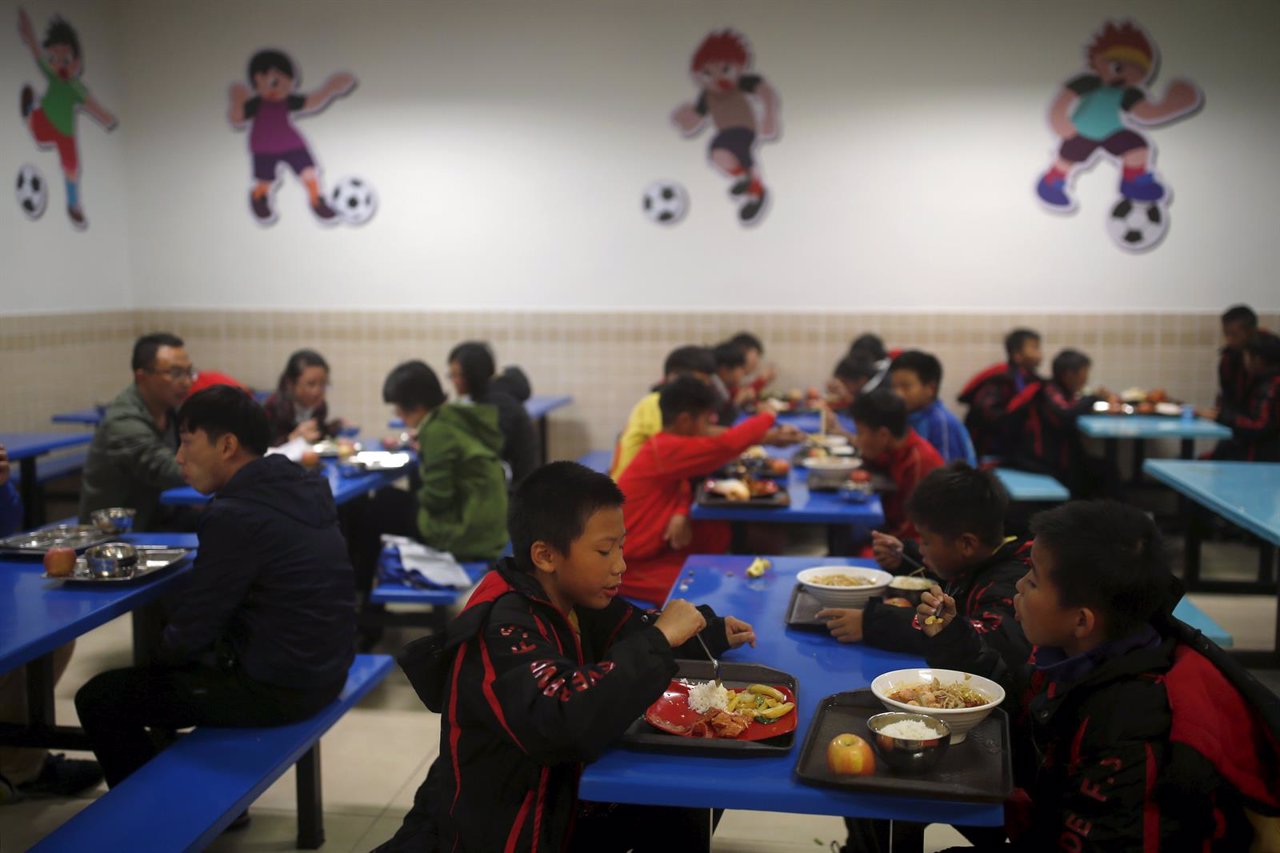 Students have dinner at Evergrande soccer academy in Qingyuan, southern China