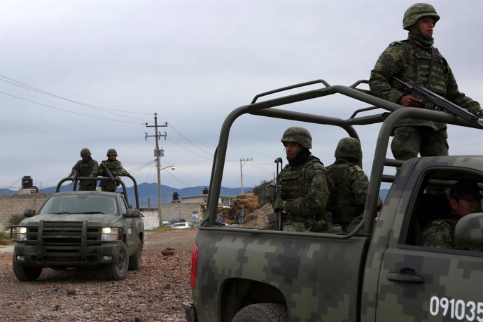 Soldiers patrol the perimeter of the Altiplano Federal Penitentiary, where drug 