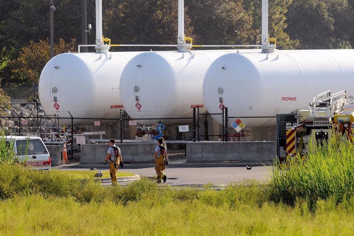 TAVARES, FL - JULY 30:  Firefighters walk past propane cylinders on the grounds 