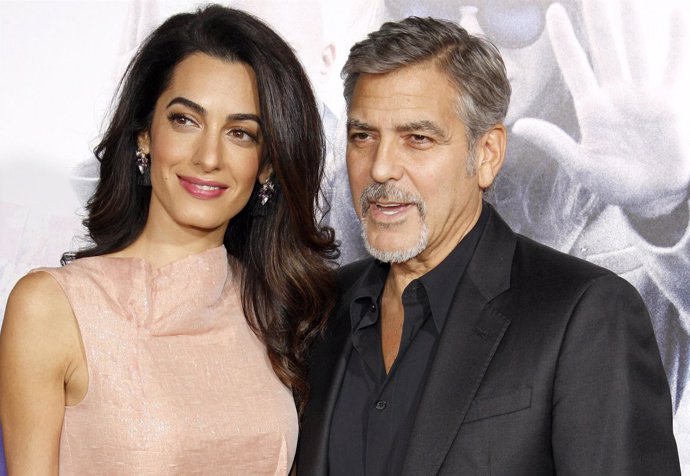HOLLYWOOD, CA, USA - OCTOBER 26, 2015: Amal Clooney and George Clooney at the Lo