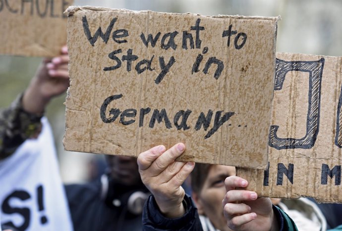 Refugiados en una manifestación para quedarse en Alemania