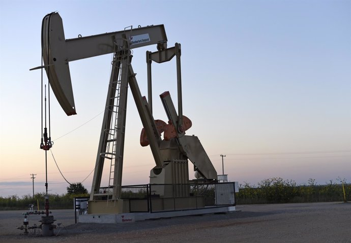 A pump jack operates at a well site leased by Devon Energy Production Company ne
