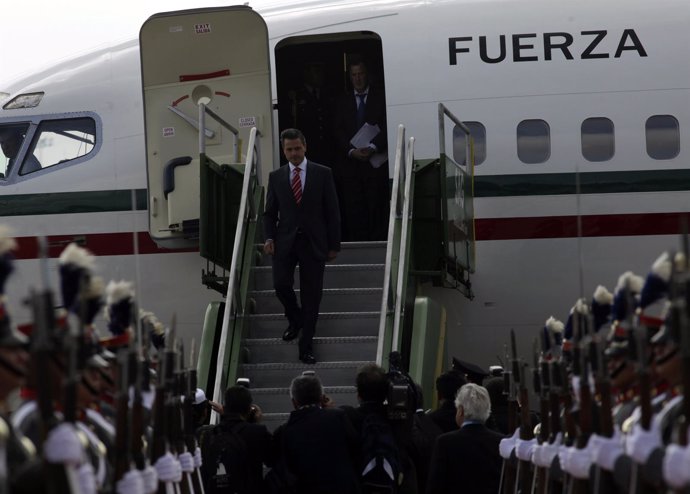 Mexico's President Pena Nieto disembarks from a plane upon his arrival at an air
