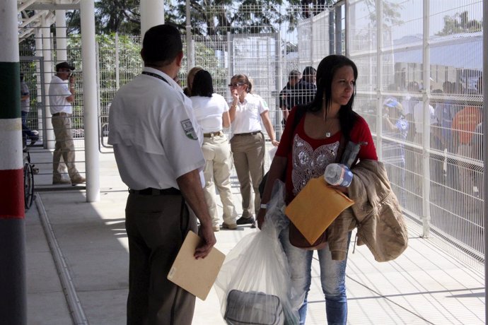 A Cuban migrant arrives after she traveled from Costa Rica to El Salvador and co