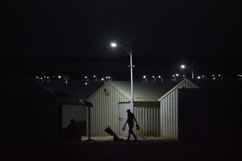 IKEA-donated Solar lights turn as night falls throughout in Azraq Refugee Camp, 