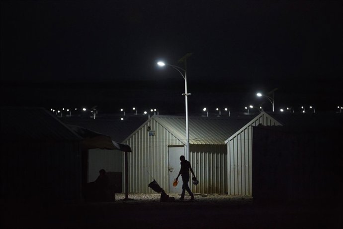 IKEA-donated Solar lights turn as night falls throughout in Azraq Refugee Camp, 