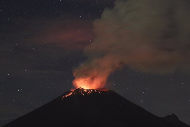 Smoke rises from the Popocatepetl as it spews incandescent volcanic material on 