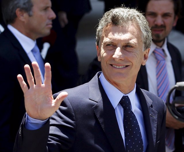 Argentina's President Mauricio Macri waves as he leaves Buenos Aires' cathedral