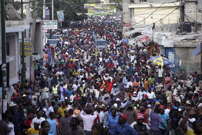 Protesters march during a demonstration rallying for the resignation of Presiden