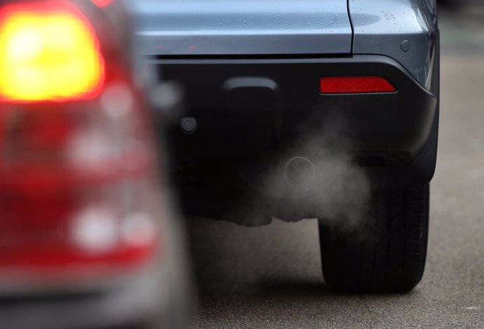 PUTNEY, ENGLAND - JANUARY 10: Exhaust fumes show on a car in Putney High Street 