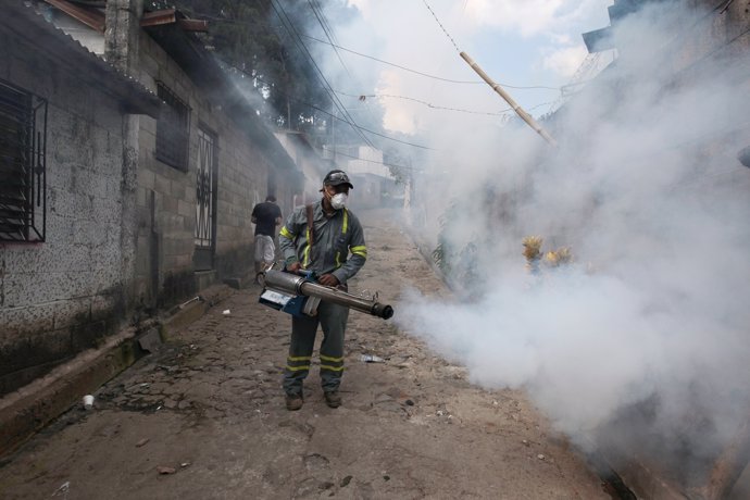 City health workers fumigate the Guadalupe community as part of preventive measu
