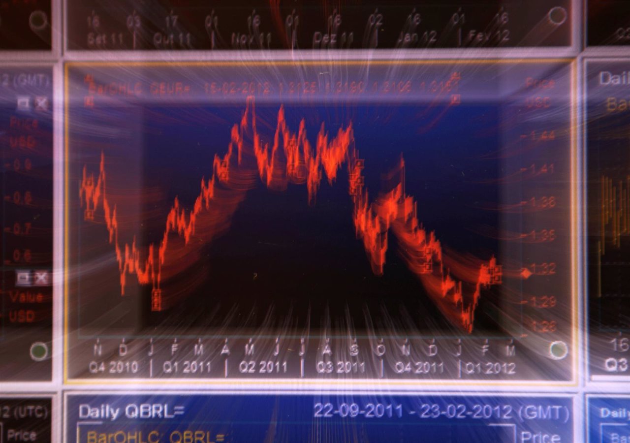 A graphic of the Euro-Dollar relation currencies are seen on a screen at a bank 