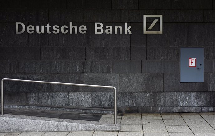A fire hydrant is seen next to the logo of Germany's Deutsche Bank in Frankfurt