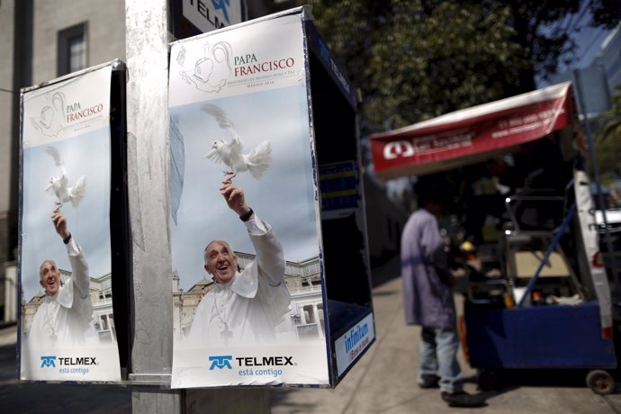 Phone booths covered with images of Pope Francis are seen ahead of his upcoming 