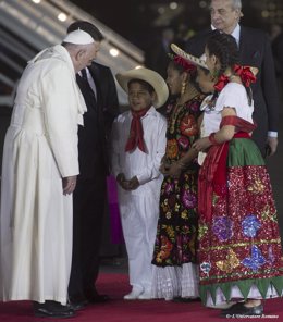 Pope Francis greets children after his arrival in Mexico City 