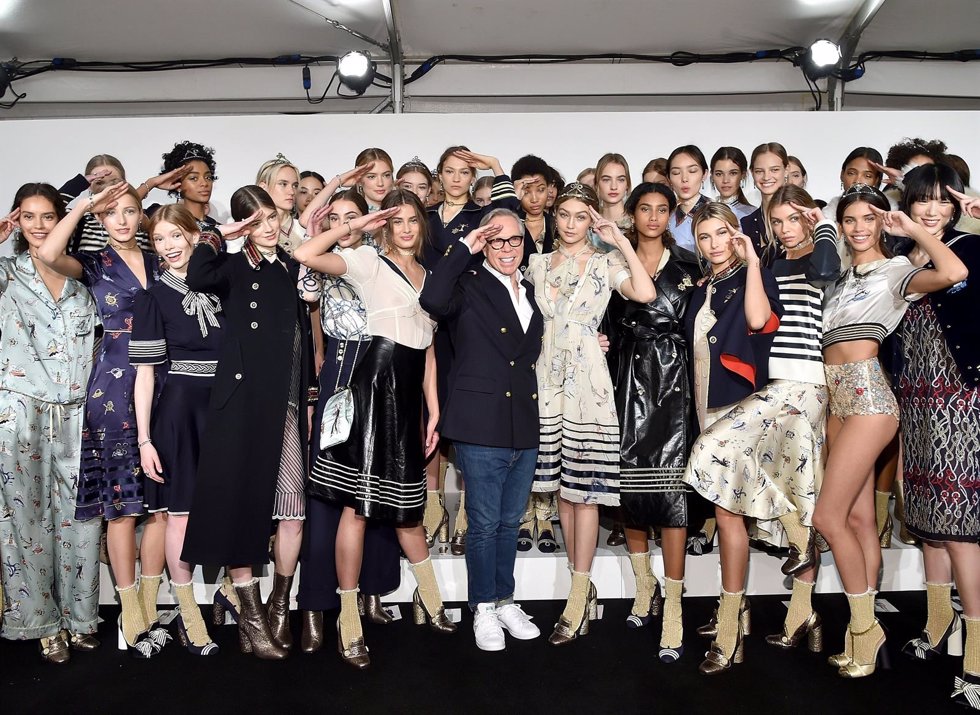 NEW YORK, NY - FEBRUARY 15:  Designer Tommy Hilfiger and models pose backstage a