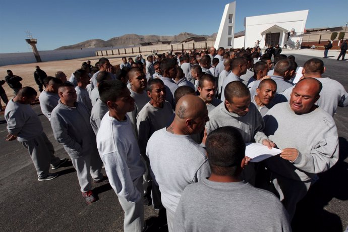 Inmates rehearse a song they will sing for Pope Francis in preparation for his u
