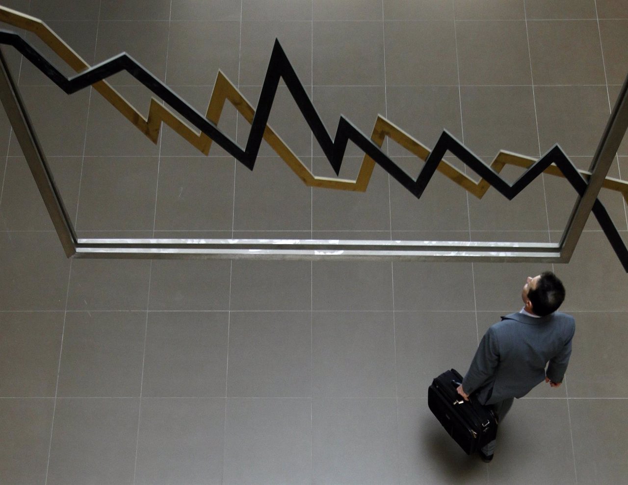 A man walks inside the Athens' stock exchange in Athens