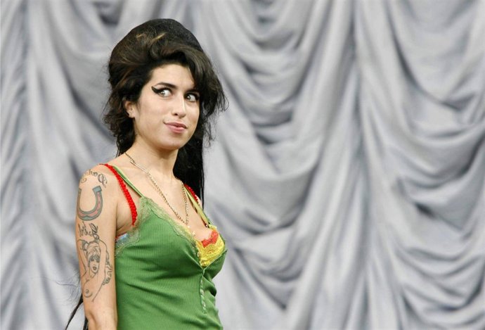 FILE PICTURE - Amy Winehouse plays the Pramid Stage at Glastonbury.  A national 