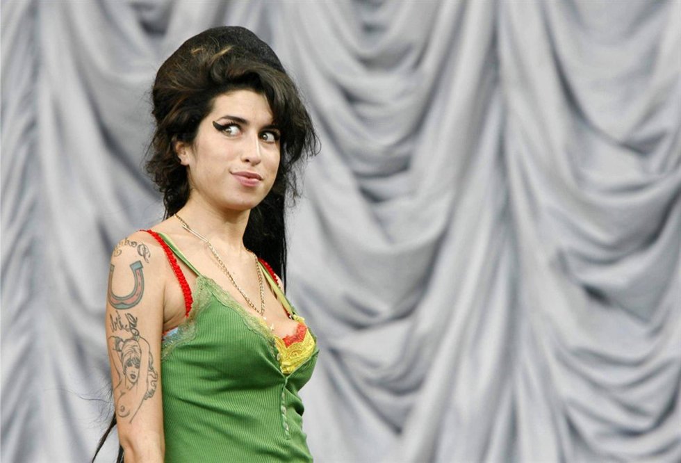 FILE PICTURE - Amy Winehouse plays the Pramid Stage at Glastonbury.  A national 