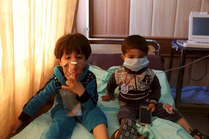 Children receive oxygen, after suffering from choking, at a hospital in Taza sou