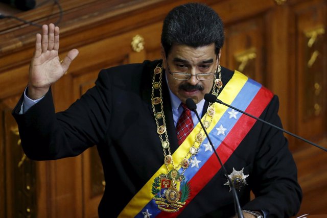 Venezuela's President Nicolas Maduro gestures while he addresses lawmakers durin