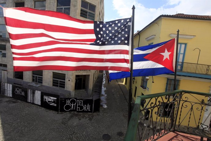 U.S. And Cuban flags are seen on the balcony of a restaurant in downtown Havana