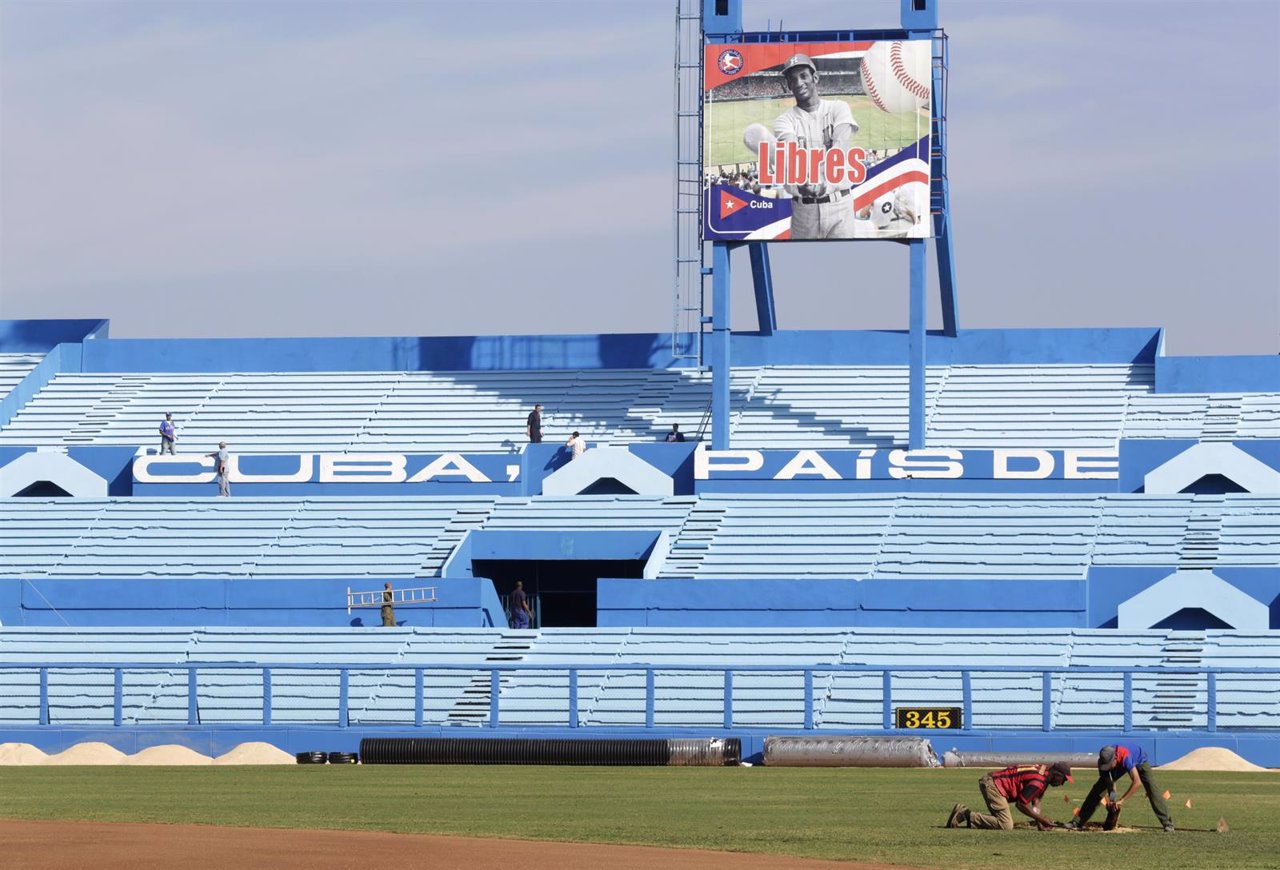 Workers are seen at the Latinoamericano baseball stadium ahead of an exhibition 