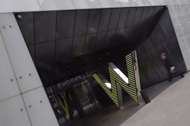 A man walks into the 'W London' hotel in Leicester Square in central London