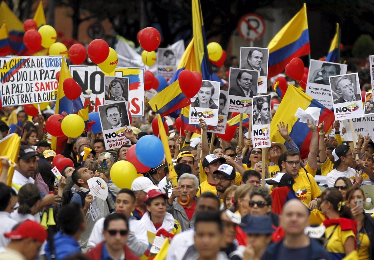 Demonstrators take part in a protest against the Revolutionary Armed Forces of C