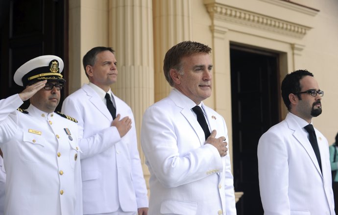 Brewster, new U.S. Ambassador to the Dominican Republic, stands at attention dur