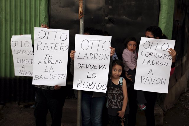 Local residents protest against Perez prior to his arrival at Matamoros Army Bas