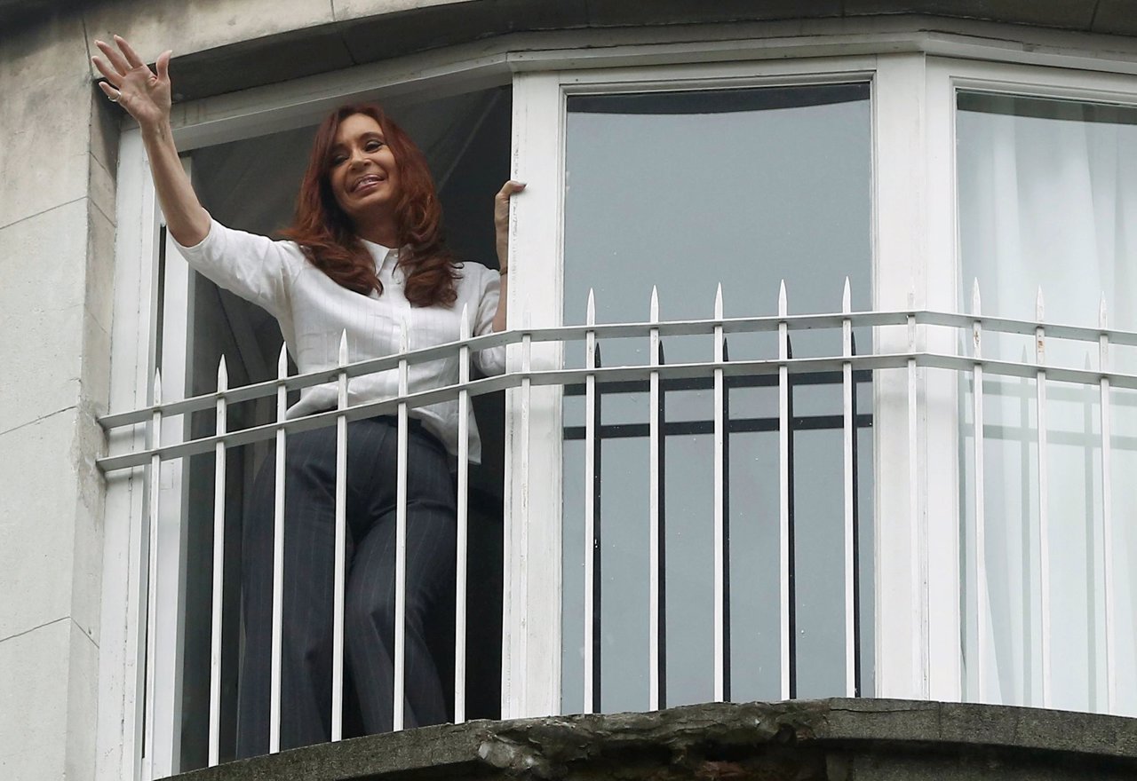 Former Argentine President Cristina Fernandez de Kirchner waves from the balcony