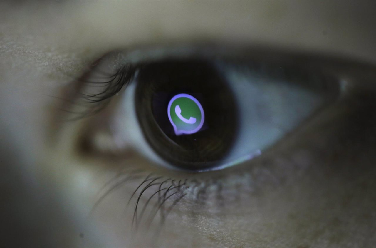  Whatsapp's logo reflected in a person's eye