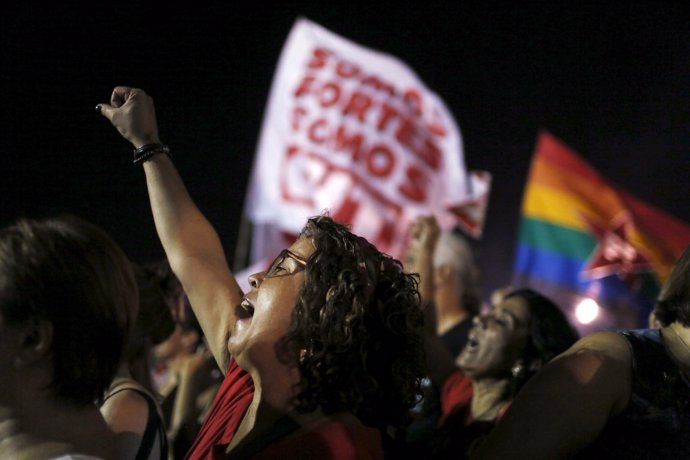 Demonstrators yell slogans during a protest against President Dilma Rousseff's i