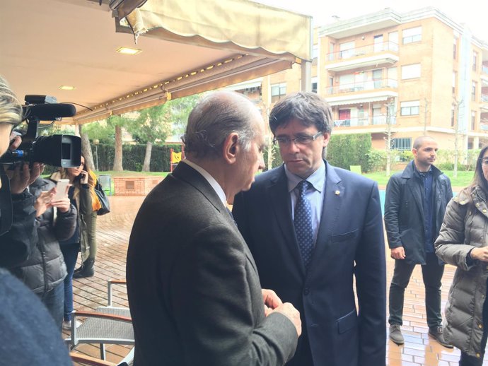 Ministro Jorge Fernández Díaz, presidente Carles Puigdemont